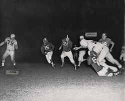 Run play during Petaluma Leghorn game against the Oakland Owls