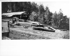 Truck hauling a log to Jim Thorpe's sawmill on Buckhan Fauch