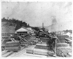 Employees of Duncans Mills stacking milled lumber at Duncans Mills, 1923