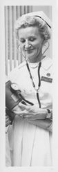 Nurse F. Chiara taking a patient's blood pressure, Petaluma, California, 1957