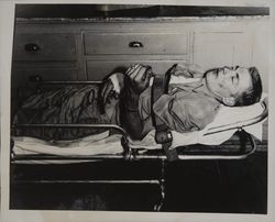 Walter Rubendall strapped to an ambulance gurney in the Villa Fonte's, Petaluma, California, May 1952