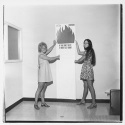 Putting up an United Crusade poster, Santa Rosa, California, 1971