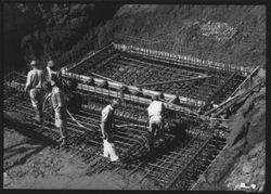 Workers constructing unidentified bridge