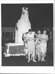 Young men pulling a float decorated with a horse, Petaluma, California, 1962