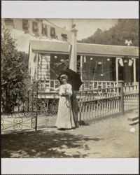 Woman at the gate of a resort in the country, Marin County, California, between 1900 and 1910