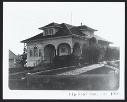 Hip roof vernacular home with Palladian adaptations