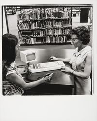 Demonstrating the Library's new circulation computer, Santa Rosa , California, 1977]