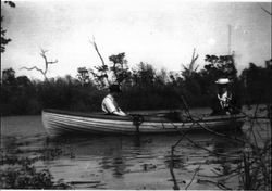 Couple boating on Lake Jonive in the Laguna de Santa Rosa, near Sebastopol, California, about 1910