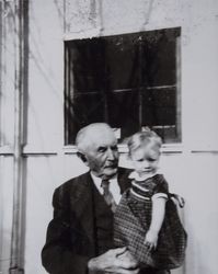 Jacob Friedrich Volkerts holds Nancy Cathleen Evans in Petaluma, California, about 1942