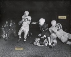 Run play during Petaluma Leghorns game against Pittsburg