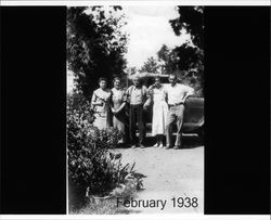 Emma and Seymour Brush standing by a car with their children, February 1938 in Chico, California