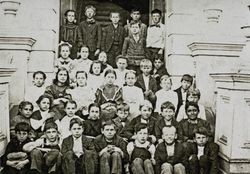 Children sitting in front of the D Street School, Petaluma, California, 1906