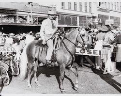 Art Weller on horseback in downtown, Petaluma, 1942