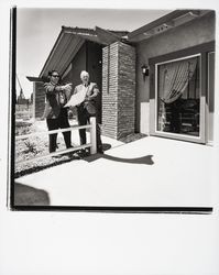 Richard Corwin and an unidentified man inspecting a model home, Santa Rosa, California, 1970