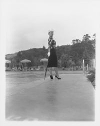 Fringed, plaid top over a black dress modeled in the Dramatic Moods of Autumn Fashion Show, Santa Rosa, California, 1959