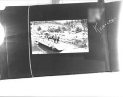 Jack and Charmian London crossing the bridge in Kennett, California, 1911