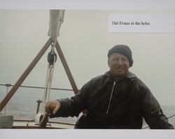 Harold R. "Hal" Evans at the helm of his boat on Tomales Bay, Marin County, California, 1960s