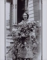 Vivian Chandler Kehl surrounded by roses, Petaluma, California, in the 1930s