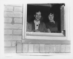 Margaret Bryan and Jayan Hobbs at ticket window for Petaluma High School basketball games, Petaluma, California, 1955