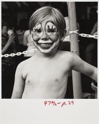 Boy with clown face at the Sonoma County Fair, Santa Rosa, California