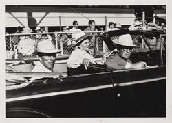 Racetrack personnel drive by at the Sonoma County Fair, Santa Rosa, California, 1956