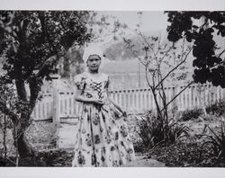 Cecilia Hunt poses in her pretty dress in a garden, Sonoma County, California