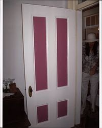 Nancy Sasser standing in the doorway of the Wiliam Pepper House at 28 Pepper Lane, Petaluma, California, Sept. 22, 2006