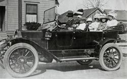 Charles E. Raymond and family touring in his father's first automobile, an Overland touring car, Petaluma, California, about 1911