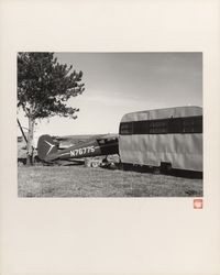 Petaluma scene with travel trailer and small single engine airplane, Petaluma, California, about 1970