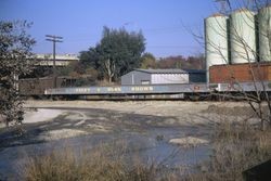 Foley & Burk Shows flatcars on tracks adjacent to Albers Milling Co. in Santa Rosa, Jan. 1972