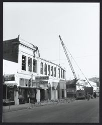 Demolishing buildings on Kentucky Street after the fire