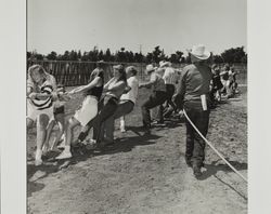 Tug of war on Farmer's Day with bath at the Sonoma County Fair, Santa Rosa, California, 1986
