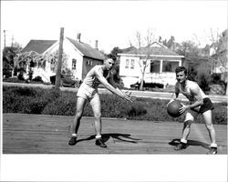 Two unidentified Petaluma Cooperative Creamery basketball team members pose for a picture., Petaluma, California, about 1934