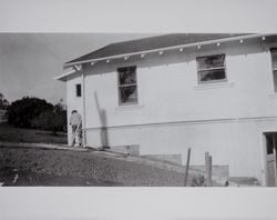 Lewis B. Evans paints the Evans home, Petaluma, California, 1948