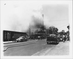 Extinguishing the fire at the California Theatre, Petaluma, California, 1957