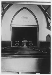 Stained glass window and interior of "The Church Built from One Tree."