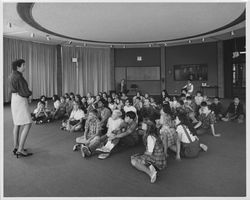 Molly McDermott speaking to a group of children in the Forum Room