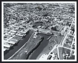 Aerial view of the City of Petaluma and the head of the Petaluma River navigation channel, 1969