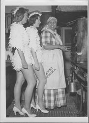 Two girls dressed as chickens with Aunt Jemima, Petaluma, California, about 1954