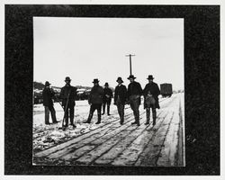 Northwestern Railroad section hands clearing snow from tracks