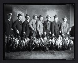 Duck hunters posing with their catch