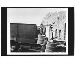 Adolph Calegari and Jim Varni collecting garbage in Petaluma, California, about 1937