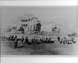 Group of men and horses in front of unidentified Alexander Valley home