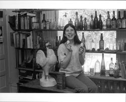 Suzy Mannion and bottle collection of Ed Mannion