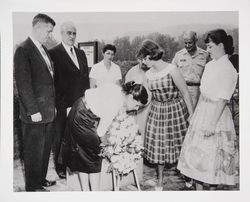 Lancaster High School students placing wreath of Shasta daisies on newly decorated memorial to Luther Burbank, Aug. 29, 1959