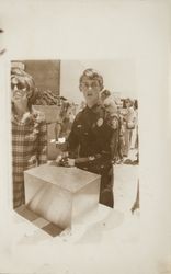 Alice Wells and Jerry Swatts with time capsule at Rohnert Park Public Library