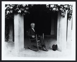Luther Burbank in a rocker on the porch of his Tupper Street home