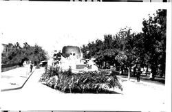 Float containing a large egg, women and soldiers in dark uniforms, Petaluma, California, about 1923