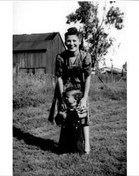 Alba Silva with her son Alvin taken in their backyard at 715 Western Avenue, Petaluma, California, about 1941