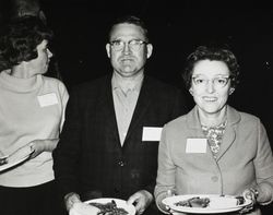 Jack W. and Mary Dei standing with plates in their hands at an unidentified dairy function, about 1968